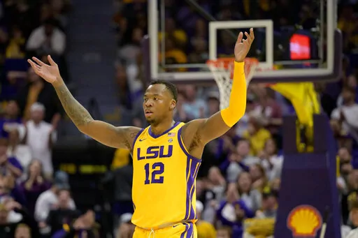 LSU forward KJ Williams gestures to the crowd during the second half of the team's NCAA college basketball game against Arkansas in Baton Rouge, La., Wednesday, Dec. 28, 2022. (AP Photo/Matthew Hinton)