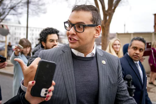 Rep. George Santos, R-N.Y., leaves a House GOP conference meeting on Capitol Hill in Washington, Jan. 25, 2023. Santos told colleagues in a closed-door meeting Tuesday that he is temporarily stepping down from his two congressional committees. (AP Photo/Andrew Harnik, File)