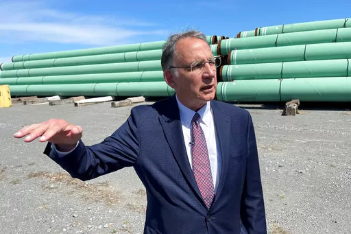 FILE- Sen. John Boozman, R-Ark, talks to reporters while visiting Welspun Pipes in Little Rock, Ark., March 25, 2022. Boozman is running for reelection and faces three challengers in the state's Republican primary in May. (AP Photo/Andrew DeMillo, File)