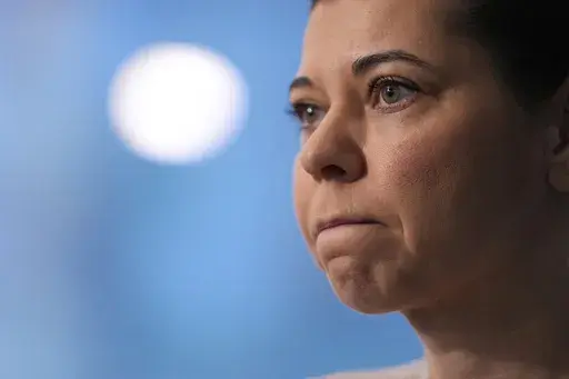 Dani Dumitriu talks to reporters at her office in New York, Thursday, March 20, 2025. (AP Photo/Seth Wenig)