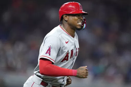 Los Angeles Angels' Monte Harrison draws a walk during the team's baseball game against the Miami Marlins, July 6, 2022, in Miami. Arkansas has confirmed a report that Harrison, a 28-year-old outfielder who played parts of three seasons with the Angels and Marlins, plans to walk on with the Razorbacks’ football program. (AP Photo/Lynne Sladky, File)