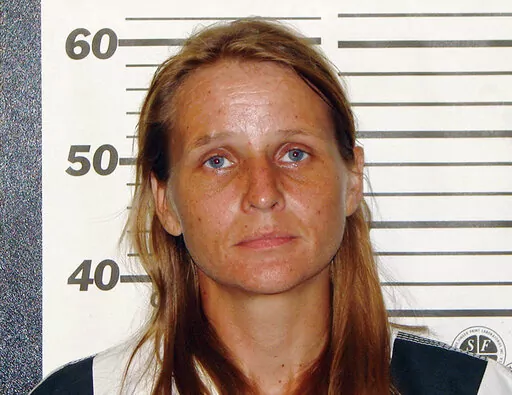This undated photo provided by the Ozark County Sheriff's Office in Gainesville, Mo., shows Rebecca Ruud, who, along with her husband, Robert Peat Jr., were indicted Wednesday, Sept. 20, 2017, in the death of the Ruud's biological teenage daughter, who spent most of her life with an adoptive family in Minnesota. In July 2022, Rudd was acquitted of killing her daughter but convicted of abandoning the girl's corpse. On Thursday, Sept. 15, 2022, Rudd was sentenced but will be released from prison s