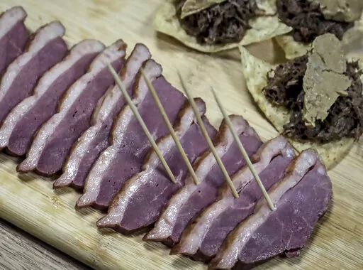 Samples of foie gras delicacy from ducks farmed at Hudson Valley Foie Gras duck farm are displayed on July 18, 2019, in Ferndale, N.Y. New York City’s ban on the sale of foie gras, already delayed by a court challenge, has now been found in violation of state agricultural law. (AP Photo/Bebeto Matthews, File)