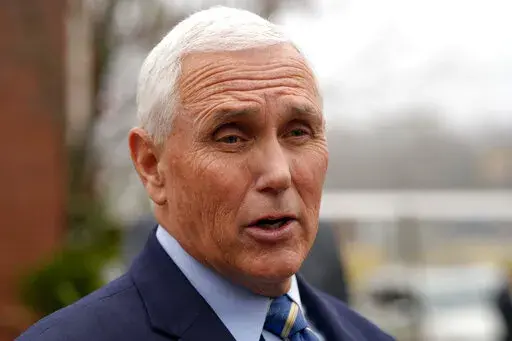 Former Vice President Mike Pence speaks with reporters Dec. 6, 2022, at Garden Sanctuary Church of God in Rock Hill, S.C. The executive director of former U.N. Ambassador Nikki Haley's political action committee is leaving to help run PAC efforts for Pence.(AP Photo/Meg Kinnard, File)