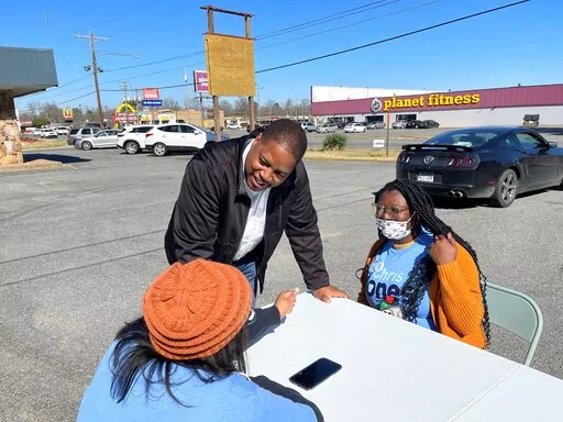 Democratic gubernatorial candidate Chris Jones speaks to campaign volunteers outside his campaign office in Pine Bluff, Ark. on Saturday, February 19, 2022. (AP Photo/Andrew DeMillo)
