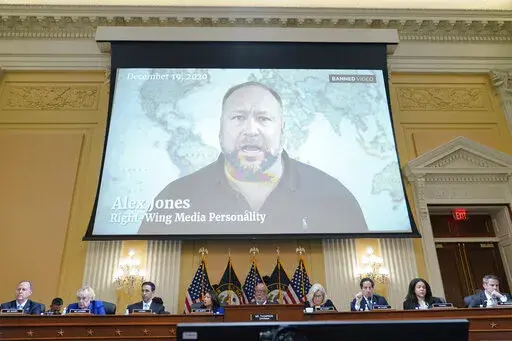 In this July 12, 2022 file photo, a video showing Alex Jones is shown as the House select committee investigating the Jan. 6 attack on the U.S. Capitol holds a hearing at the Capitol in Washington. An attorney representing two parents who sued Jones over his false claims about the Sandy Hook massacre says the U.S. House Jan. 6 committee has requested two years’ worth of records from Jones’ phone. Attorney Mark Bankston said in court Thursday, Aug. 4, 2022 that the committee investigating the