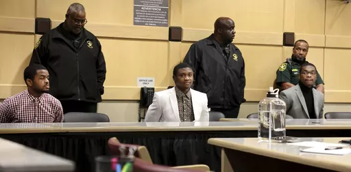 CORRECTS THE POSITIONS OF WILLIAMS AND NEWSOME - Dedrick Williams, left, Trayvon Newsome, center, and Michael Boatwright were found guilty of first-degree murder of XXXTentacion at the Broward County Courthouse in Fort Lauderdale on Monday, March 20, 2023. (Carline Jean/South Florida Sun-Sentinel via AP, Pool)