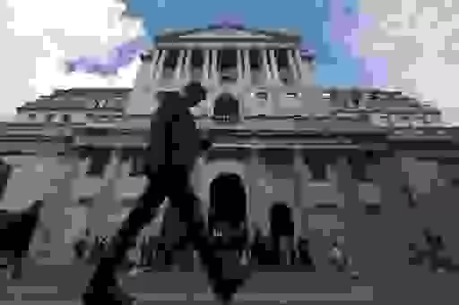 A man walks past the Bank of England, at the financial district in London, Thursday, May 11, 2023. The Bank of England is set to raise interest rates later Thursday to their highest level since late 2008 as it continues to combat stubbornly high inflation in the U.K. (AP Photo/Frank Augstein)