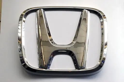 FILE- This Feb. 14, 2019 file photo shows a Honda logo at the 2019 Pittsburgh International Auto Show in Pittsburgh. Honda is recalling a half-million vehicles in the U.S. and Canada, Wednesday, March 15, 2023, because the front seat belts may not latch properly. The recall covers some of the the automaker’s top-selling models including the 2017 through 2020 CR-V, the 2018 and 2019 Accord, the 2018 through 2020 Odyssey and the 2019 Insight. Also included is the Acura RDX from the 2019 and 2020