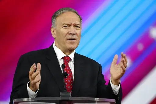 Former Secretary of State Mike Pompeo, speaks at the Conservative Political Action Conference (CPAC) Friday, Feb. 25, 2022, in Orlando, Fla. The State Department says it's paying more than $2 million per month to provide 24-hour security to Pompeo and a former top aide, both of whom face “serious and credible” threats from Iran.  That's according to a report sent to Congress last month and obtained by The AP on Saturday, March 12. (AP Photo/John Raoux, File)