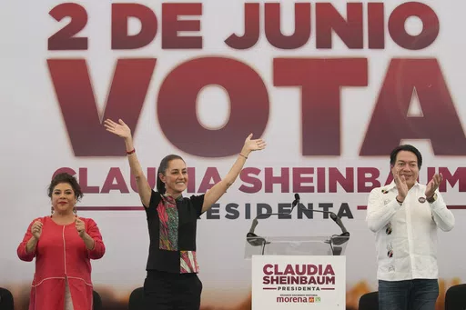 Ruling party presidential candidate Claudia Sheinbaum, center left, greets supporters at a campaign rally, flanked by mayoral candidate Clara Brugada and Morena party president Mario Delgado, in Mexico City, May 16, 2024. (AP Photo/Marco Ugarte, File)