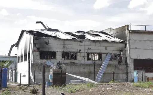 In this photo taken from video a view of a destroyed barrack at a prison in Olenivka, in an area controlled by Russian-backed separatist forces, eastern Ukraine, on July 29, 2022. Russia and Ukraine accused each other Friday of shelling a prison in a separatist region of eastern Ukraine, an attack that reportedly killed dozens of Ukrainian military prisoners who were captured after the fall of a southern port city of Mariupol in May. (AP Photo)