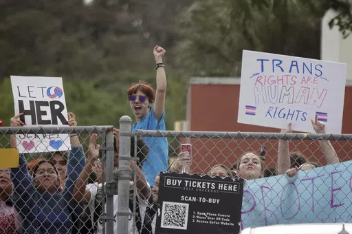 Students from Monarch High School in Coconut Creek, Fla., walk out of the school building Nov. 28, 2023, in support of a transgender student who plays on the girls volleyball team. A new federal regulation protecting the rights of transgender students has prompted lawsuits from GOP states that say it would require them to allow transgender athletes to compete on school teams. (Joe Cavaretta/South Florida Sun-Sentinel via AP, File)