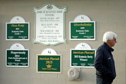 Trainer Bob Baffert stands outside his barn at Churchill Downs Monday, May 2, 2016, in Louisville, Ky. Medina Spirit was stripped of the victory in last years Kentucky Derby and Mandaloun was declared the winner in a ruling by state racing stewards on Monday, Feb. 21, 2022. (AP Photo/Charlie Riedel, FIle)