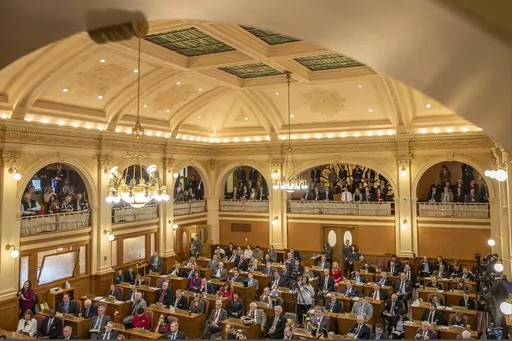 In this Jan. 8, 2019 photo, South Dakota state legislators listen while Gov. Kristi Noem delivers the State of the State address at the state Capitol in Pierre, S.D. Republican leaders are resisting calls to spell out in law the circumstances under which women can legally have abortions under “life of the mother” exceptions in states with strict bans. Lawmakers are suggesting instead that abortion providers just need more information about existing laws, or that they are knowingly avoiding l