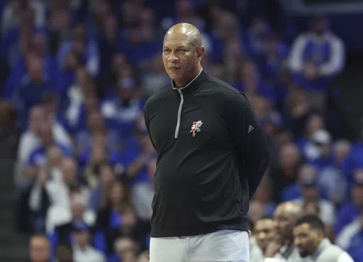 Louisville coach Kenny Payne watches the team during the second half of an NCAA college basketball game against Kentucky in Lexington, Ky.,Dec. 31, 2022. Arkansas has announced that Payne has been named associate head coach under new head coach John Calipari. Payne spent 10 years as an assistant for Calipari at Kentucky. (AP Photo/James Crisp, File)