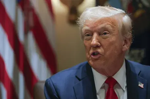President Donald Trump speaks during a Cabinet meeting at the White House in Washington, Wednesday, Feb. 26, 2025. (Pool via AP)