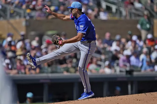 Kansas City Royals starting pitcher Michael Wacha throws against the Arizona Diamondbacks during the third inning of a spring training baseball game, Thursday, March 14, 2024, in Scottsdale, Ariz. (AP Photo/Matt York)