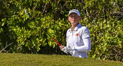 Stacy Lewis looks over the ninth green before hitting from a bunker during the second round of the LPGA Drive On Championship golf tournament at Crown Colony Golf & Country Club, Friday, Feb. 4, 2022, in Fort Myers, Fla. (AP Photo/Steve Nesius)