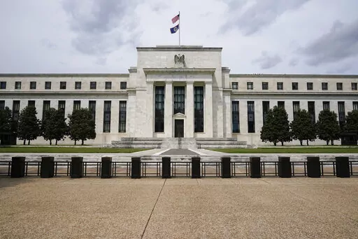 In this May 4, 2021 file photo is the Federal Reserve in Washington. Americans' financial health reached its highest level in nearly a decade last year, the Federal Reserve said Monday, May 23, 2022 spurred by a strong job market and government support payments. (AP Photo/Patrick Semansky, File)