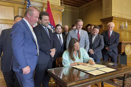 Arkansas Gov. Sarah Huckabee Sanders signs legislation at the state Capitol in Little Rock, Ark., April 10, 2023. The fiscal year ended in Arkansas with a surplus of more than $1.1 billion, which is the state's second largest, finance officials announced Wednesday, July 5. The Arkansas Department of Finance and Administration said the state's net available revenue for the fiscal year that ended on Friday, June 30, totaled nearly $7.2 billion. (AP Photo/Andrew DeMillo, File)