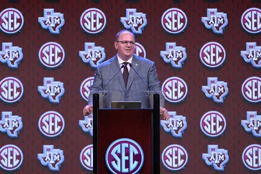 Texas A&M head coach Mike Elko speaks during Southeastern Conference NCAA college football media days, Thursday, July 18, 2024, in Dallas. (AP Photo/LM Otero)