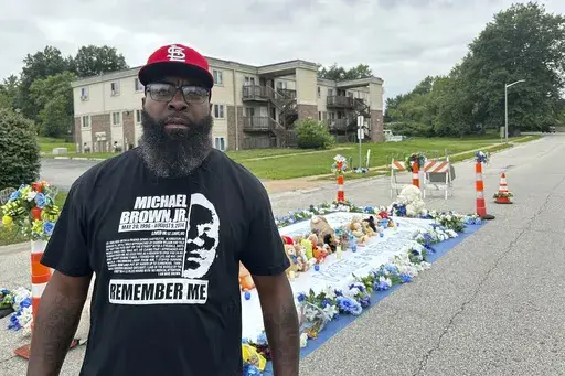 Michael Brown Sr. stands near the memorial to his son on Canfield Drive in Ferguson, Mo., on Wednesday, Aug. 7, 2024. (AP Photo/Jim Salter)
