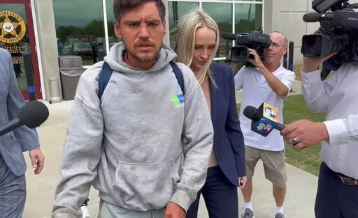 Randal Worcester walks out of the Crawford County Justice Center in Van Buren, Ark., on Aug. 22, 2022. An Arkansas law enforcement officer who held down Worcester while two others beat him during an arrest recorded on video is back on the job after he did not face any criminal charges, according to authorities Tuesday, Feb. 21, 2023. (AP Photo/Andrew DeMillo, File)