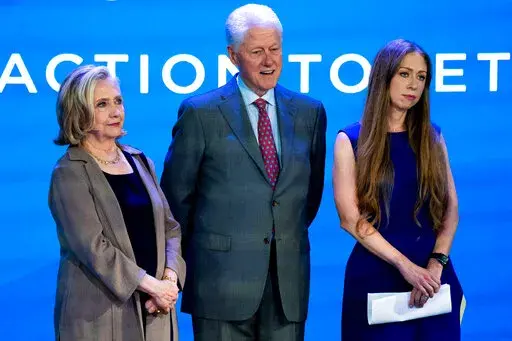 Hillary Clinton, former President Bill Clinton and Chelsea Clinton listen to Didi Bertrand speak at the Clinton Global Initiative on Sept. 19, 2022, in New York. The Clintons announced Monday, Jan. 30, 2023, that they will be joined in Nashville by aspiring leaders and global experts in business, public service and social impact. It will be the initiative's 15th annual meeting, and its first in-person gathering since before the COVID-19 pandemic. (AP Photo/Julia Nikhinson, File)