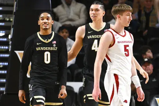Vanderbilt guard Tyrin Lawrence (0) reacts after drawing a foul during the second half of an NCAA college basketball game against Arkansas Saturday, Jan.14, 2023, in Nashville, Tenn. Vanderbilt won 97-84. (AP Photo/John Amis)