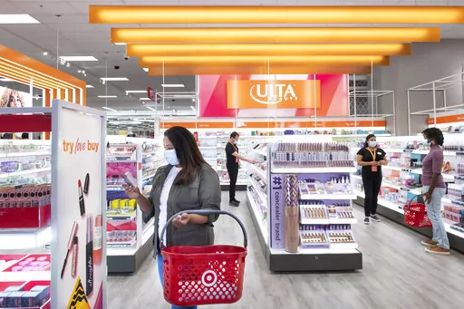 This photo provided by Target shows the Ultra Beauty inside Target department store in Edina, Minn., on Aug. 14, 2021.  Americans are splurging on beauty as they tighten their budgets elsewhere. According to market research company IRI, sales of eye, face and lip makeup has gone up across stores. It comes as major retailers slashed their financial outlooks for the year after seeing shoppers pull back on many discretionary items in the latest quarter. (Target via AP)