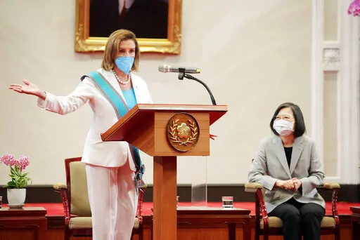 In this photo released by the Taiwan Presidential Office, U.S. House Speaker Nancy Pelosi speaks during a meeting with Taiwanese President President Tsai Ing-wen, right, in Taipei, Taiwan, Wednesday, Aug. 3, 2022. U.S. House Speaker Nancy Pelosi, meeting top officials in Taiwan despite warnings from China, said Wednesday that she and other congressional leaders in a visiting delegation are showing they will not abandon their commitment to the self-governing island. (Taiwan Presidential Office vi