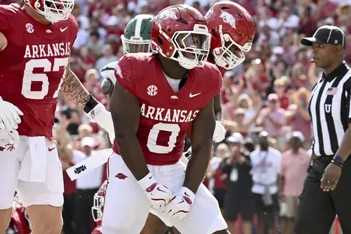 Arkansas running back Braylen Russell (0) celebrates after running for a touchdown against UAB during an NCAA college football game, Saturday, Sept. 14, 2024, in Fayetteville, Ark. (AP Photo/Michael Woods)