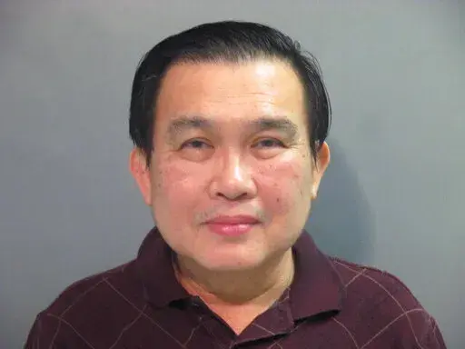 This undated file photo provided by the Washington County (Ark.) Detention Center shows Simon S. Ang. Ang, a suspended University of Arkansas professor pleaded guilty Friday to lying to the FBI about patents he had for inventions in mainland China. (Washington County Detention Center via AP, File)