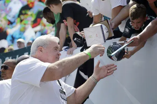 Former Philadelphia Eagles player Bill Bergey signs autographs for fans at the Eagles' NFL football training camp, Tuesday, Aug. 4, 2015, in Philadelphia. (AP Photo/Matt Rourke, File)