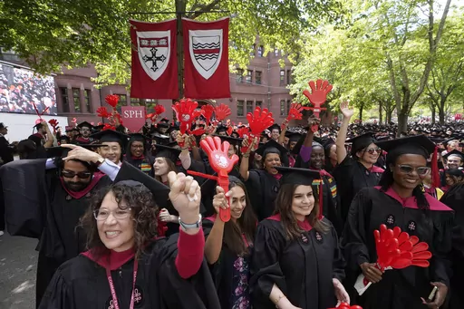 Graduating Harvard University students celebrate their degrees during commencement ceremonies, on May 25, 2023 in Cambridge, Mass. Student loan payments resume in October after a three-year pause due to the pandemic. (AP Photo/Steven Senne, File. )