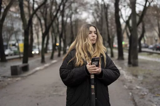 Yevheniia Synelnyk, whose brother has been in captivity for over a year and a half, stands in park in Kyiv, Ukraine, Thursday, Jan. 25, 2024. Synelnyk is also a representative of the Association of Azovstal Defenders' Families, which was created in June of 2022, shortly after around 2,500 Ukrainian servicemen surrendered to Russia on the orders of the Ukrainian president during the siege of the Azovstal steel mill in May. According to the association, around 1,500 people remain captive. (AP Phot