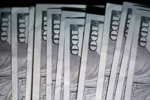 U.S. $100 bills are seen, Thursday, July 14, 2022, in Marple Township, Pa. Now that retirement spans more years than ever, you might need to rethink how you’re envisioning that stage of your life. It’s not a blip on the life radar — it’s a significant chunk of time. (AP Photo/Matt Slocum, File)