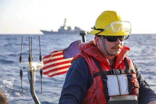 In this photo released by the U.S. Navy, Boatswain's Mate 2nd Class Hunter Pemberton, assigned to the USS Cole, takes part in an exercise on the Red Sea, March 29, 2022. Mohammed Abdul-Salam, Yemen's Houthi chief negotiator and spokesman, said late Friday, April 15, that the U.S. move in the Red Sea, which comes amid a cease-fire in the country's civil war, contradicts Washington’s claim of supporting the U.N.-brokered truce. (Mass Communication Specialist Seaman Christopher Stachyra/U.S. Navy