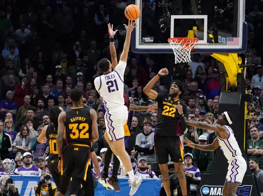 TCU forward JaKobe Coles (21) drives the lane for a basket past Arizona State forwards Alonzo Gaffney (32) and Warren Washington (22) during the second half of a first-round college basketball game in the men's NCAA Tournament, March 17, 2023, in Denver. Coles hit the winning shot with 1.5 seconds left in the first round to beat Arizona State. (AP Photo/John Leyba, File)