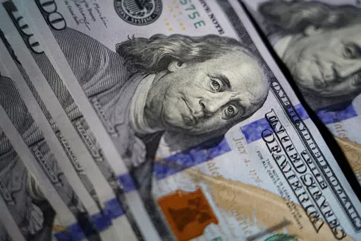 The likeness of Benjamin Franklin is seen on U.S. $100 bills, Thursday, July 14, 2022, in Marple Township, Pa. When it comes to the mental load of managing financial tasks, couples can fall into unproductive patterns that can lead to conflict, resentment and even willful ignorance. But by balancing these tasks with other household responsibilities, partners can each take ownership of occasional tasks such as doing taxes or adjusting investments, and day-to-day decisions such as budgeting and spe