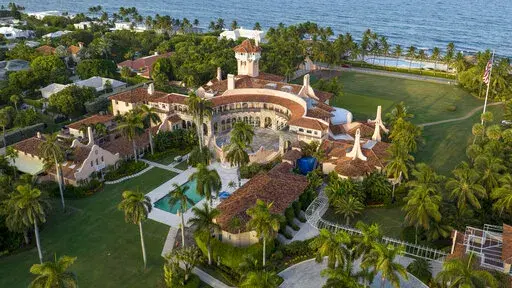 This is an aerial view of President Donald Trump's Mar-a-Lago estate, Aug. 10, 2022, in Palm Beach, Fla. The National Archives and Records Administration recovered 100 documents bearing classified markings, totaling more than 700 pages, from a initial batch of 15 boxes retrieved from Mar-a-Lago earlier this year. That's according to newly public correspondence with the Trump legal team. (AP Photo/Steve Helber, File)