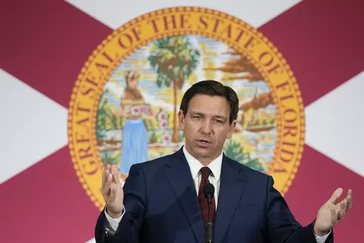 Florida Gov. Ron DeSantis speaks during a news conference to sign several bills related to public education and increases in teacher pay, in Miami, Tuesday, May 9, 2023. DeSantis and former President Donald Trump will share the spotlight in Iowa on Saturday, May 13, providing a chance to sway influential conservative activists and contrast their campaign styles in Republicans' leadoff voting state. (AP Photo/Rebecca Blackwell)