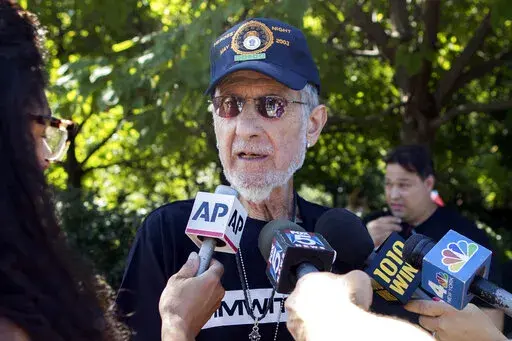 FILE —Retired New York City Police Officer Frank Serpico speaks to reporters after a rally to show support for Colin Kaepernick, Aug. 19, 2017, in New York. More than 50 years after he testified about endemic corruption in the NYPD, the department finally recognized his service and injury in the line of duty with an official certificate and inscribed medal of honor. The former undercover detective, now 85, received the honor in the mail on Thursday, Feb. 3, 2022., the New York Daily News repor