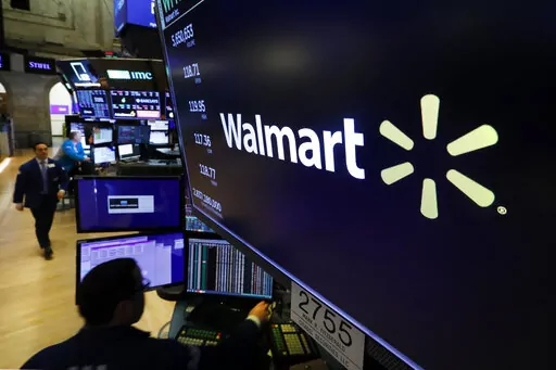 In this Feb. 18, 2020 file photo, the logo for Walmart appears above a trading post on the floor of the New York.   Walmart reports quarterly financial results reports quarterly financial results Tuesday, Nov. 15, 2022.  (AP Photo/Richard Drew, File)