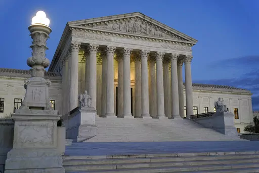 Light illuminates part of the Supreme Court building at dusk on Capitol Hill in Washington, Nov. 16, 2022. (AP Photo/Patrick Semansky, File)