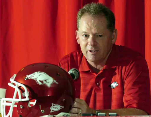 Arkansas football coach Bobby Petrino answers a question during media day at the Broyles Center in Fayetteville, Ark., Tuesday, Aug. 5, 2008. Arkansas announced Wednesday, Nov. 29, 2023, it is bringing back Bobby Petrino to be offensive coordinator, 11 years after he was fired as head coach in a sordid scandal that involved a motorcycle accident, an affair with a woman who worked for him and being untruthful to his bosses.(AP Photo/April L. Brown, File)