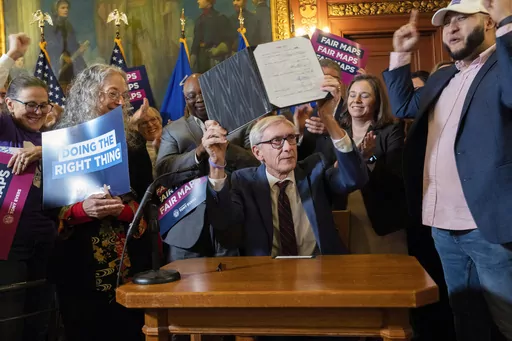 Democratic Gov. Tony Evers gestures during a press conference Monday, Feb. 19, 2024, at the Capitol in Madison, Wisconsin. Evers signed new legislative district maps into law that he proposed and that the Republicans who control the Legislature passed to avoid having the liberal-controlled state Supreme Court draw the lines.(Mark Hoffman/Milwaukee Journal-Sentinel via AP)