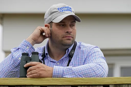 Trainer Brad Cox watches horses workout at Churchill Downs in Louisville, Ky., Thursday, April 29, 2021. Cox views his full plate this weekend at Churchill Downs as a good problem to have. Especially if his contingent of fillies hit the board in Friday’s 149th Kentucky Oaks, a race where the Louisville-born trainer has thrived. (AP Photo/Charlie Riedel, File)