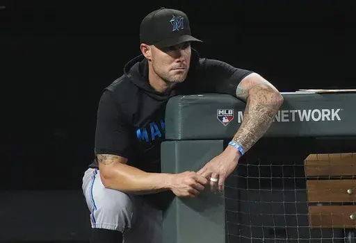 Miami Marlins manager Skip Schumaker looks on during the eighth inning of a baseball game against the Colorado Rockies, Aug. 27, 2024, in Denver. (AP Photo/David Zalubowski, File)